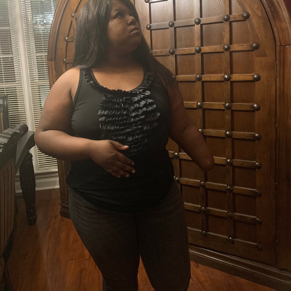 Sleeveless ruffle in front tank top.